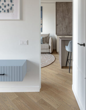 Diagonally Laid Wood Flooring Creates a Dynamic, Vibrant Interior