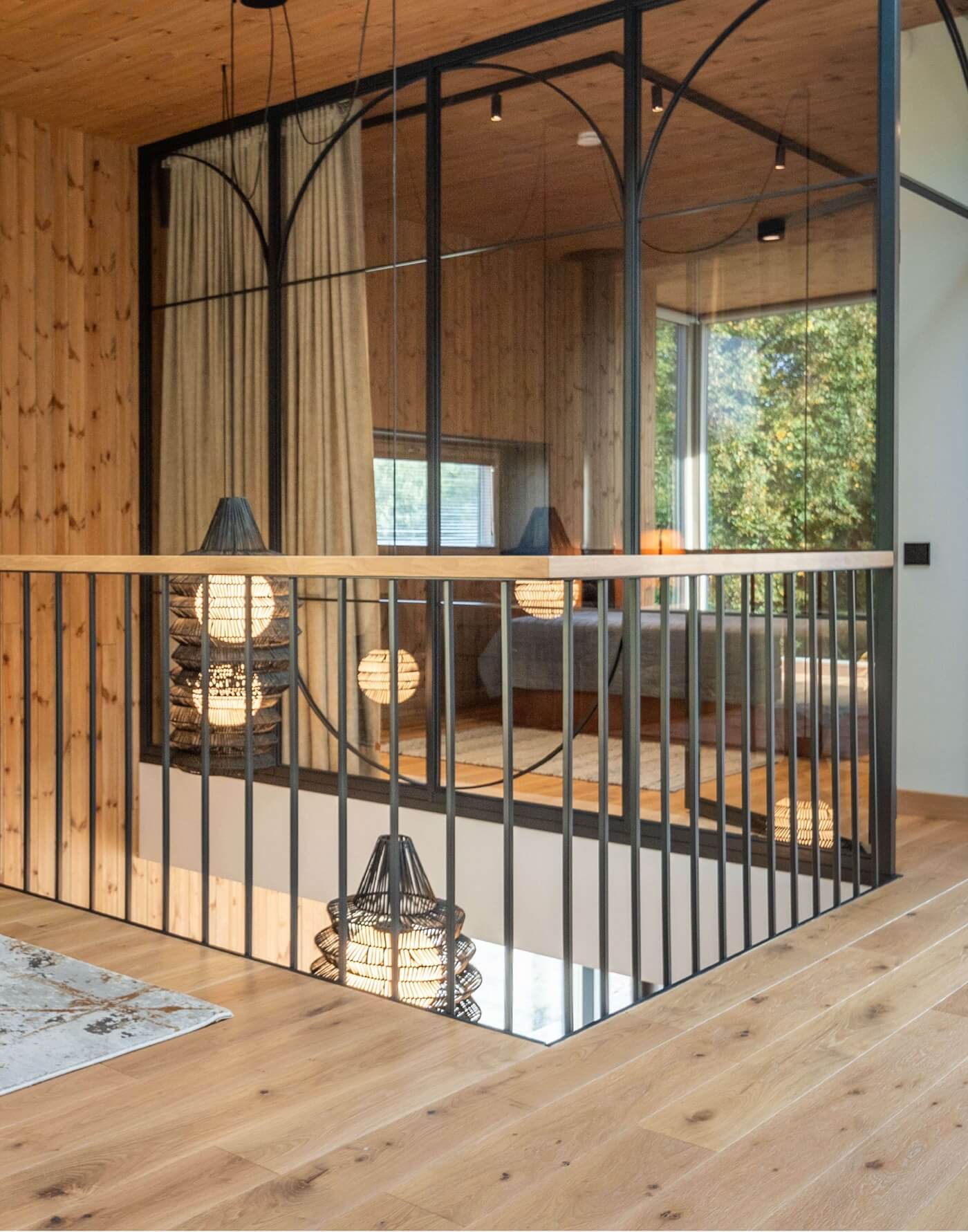 Nature inspired Coastal Interior Featuring Oak Wood Flooring, Earthy Colour Pallete and Captivating Forest Views