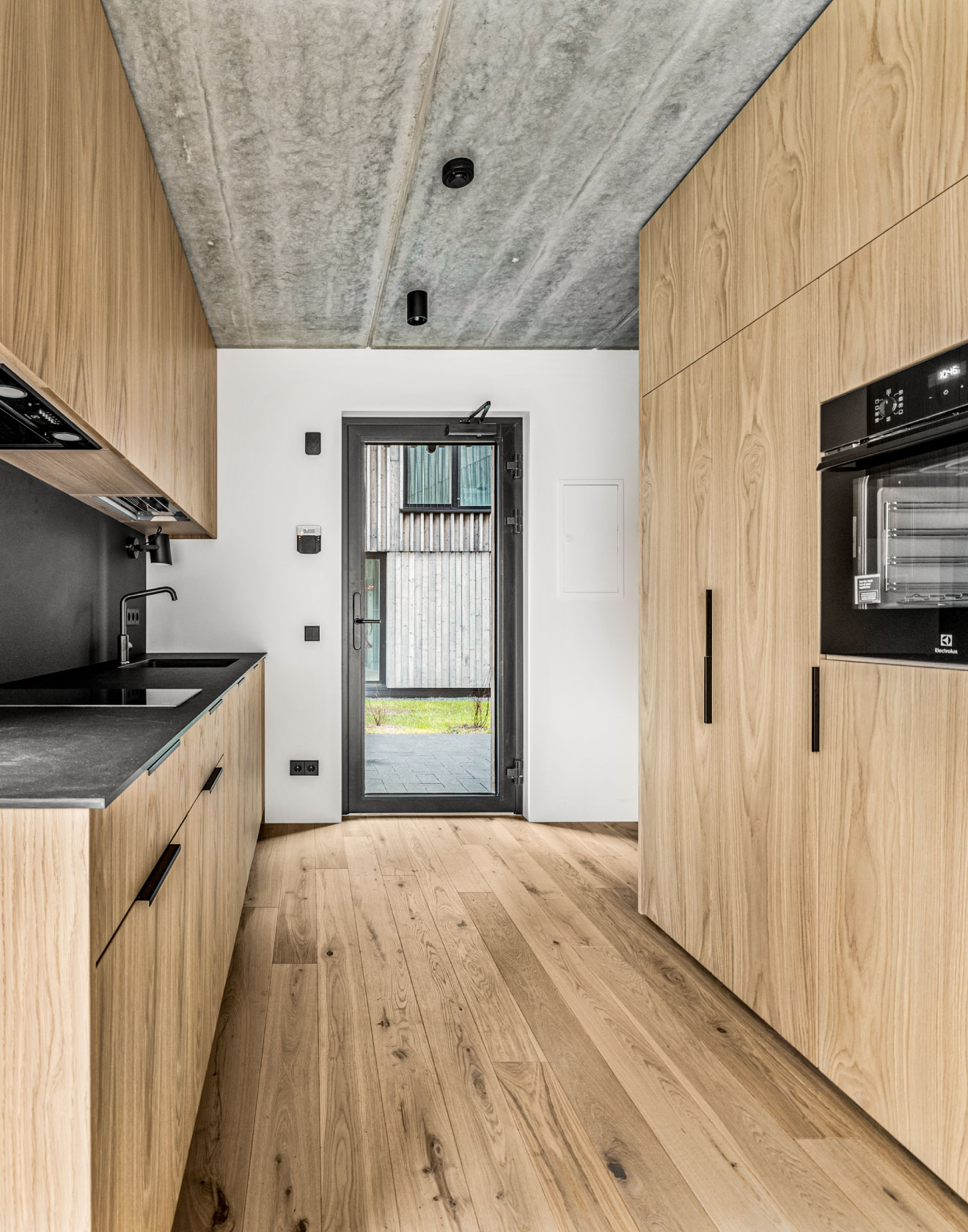 Vacation Vibes Year Round: The Rustic Charm of Oak Flooring at Svencele Dunes Apartments, Lithuania