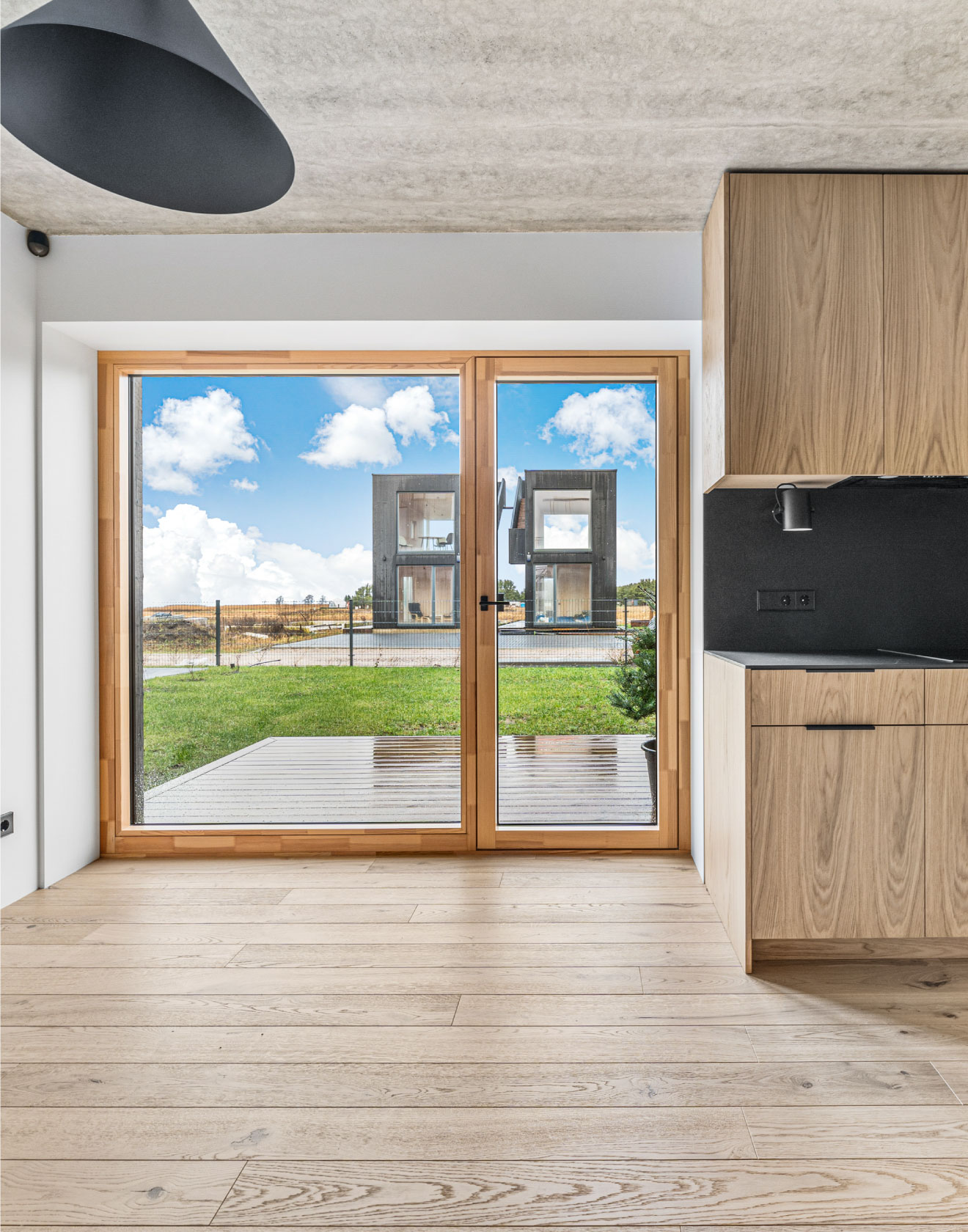 Vacation Vibes Year Round: The Rustic Charm of Oak Flooring at Svencele Dunes Apartments, Lithuania