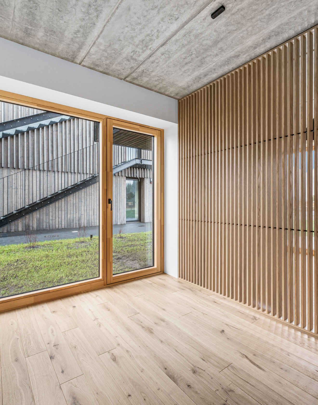 Vacation Vibes Year Round: The Rustic Charm of Oak Flooring at Svencele Dunes Apartments, Lithuania