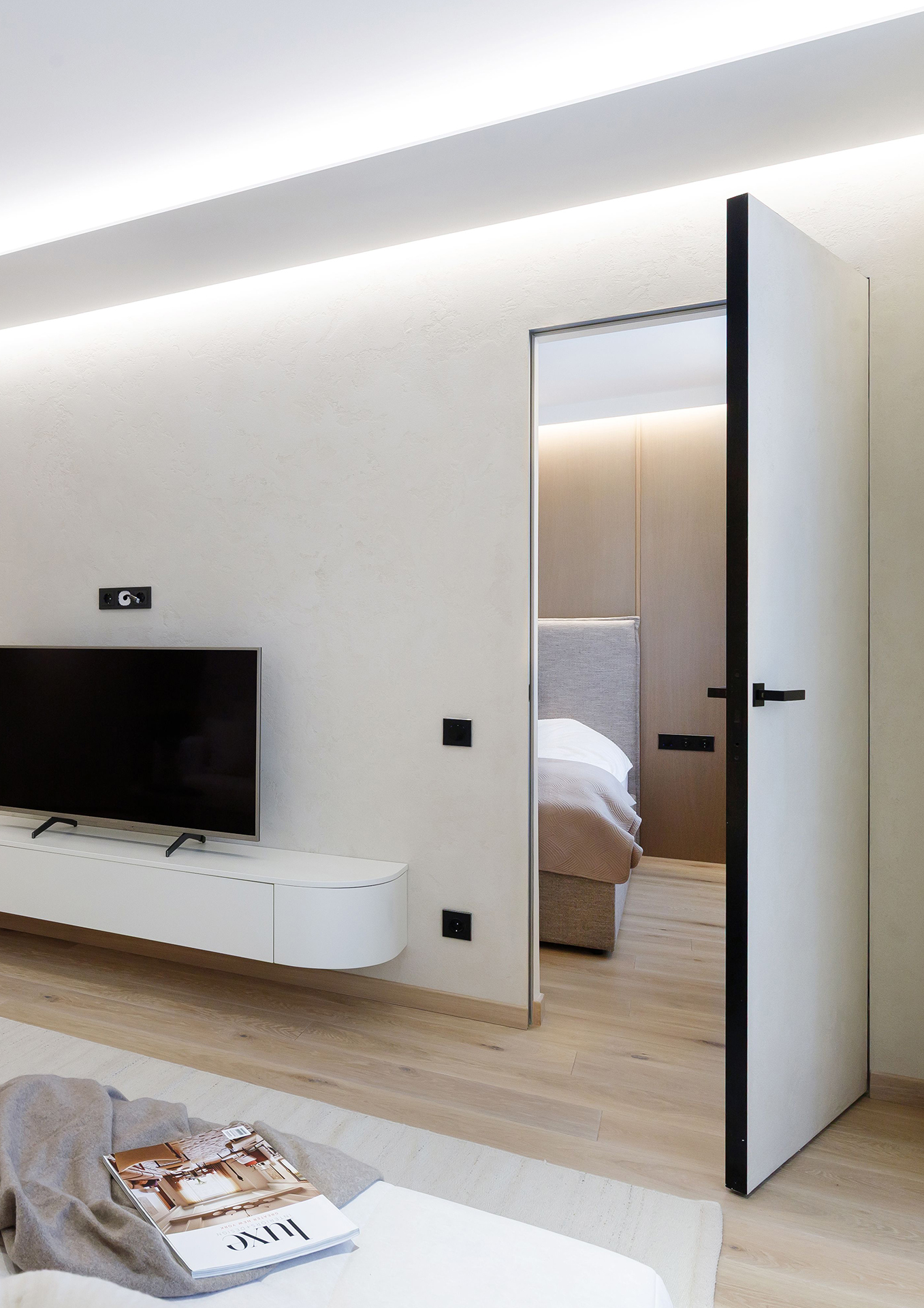 A Harmonious Apartment Defined by Natural Oak