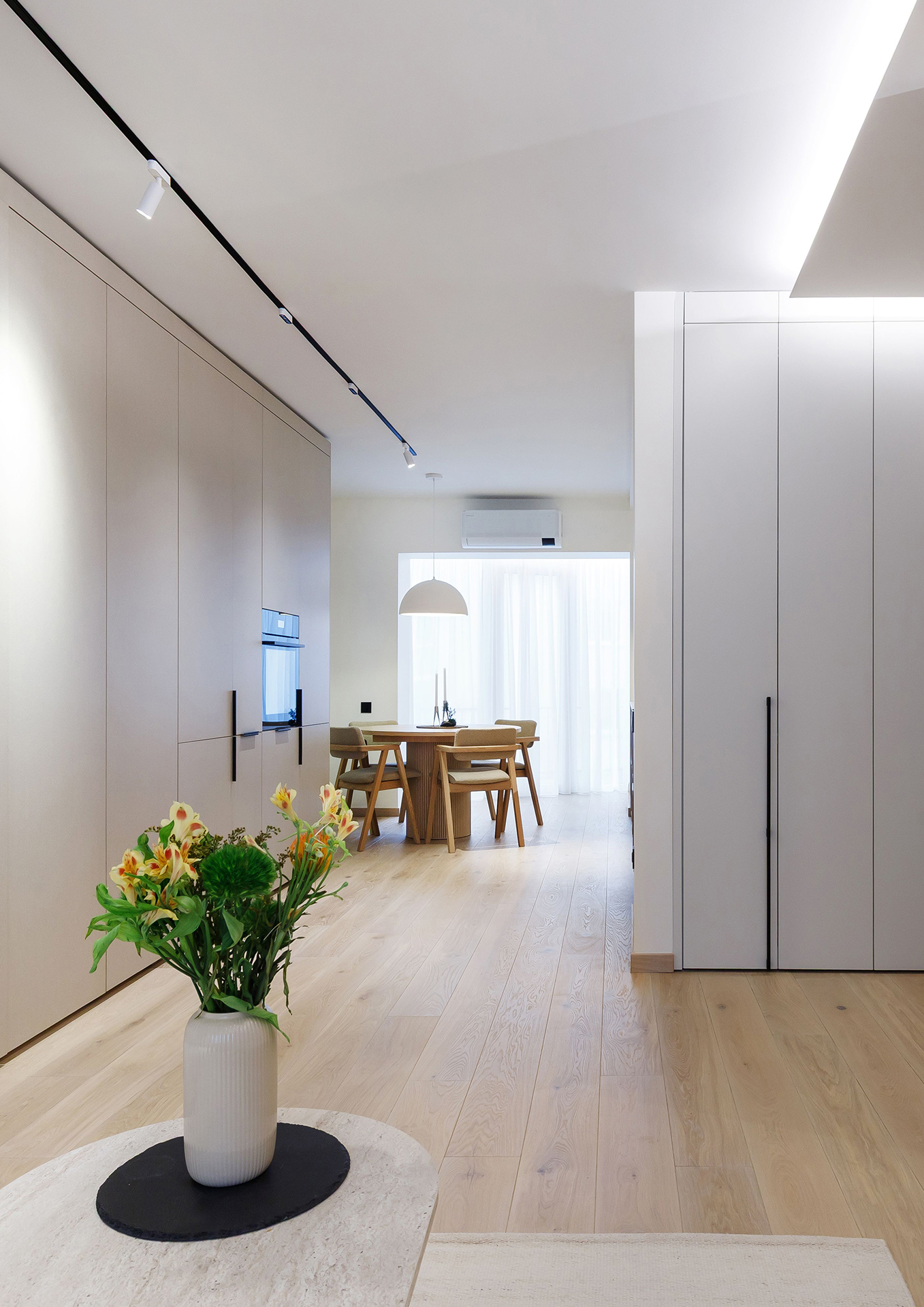 A Harmonious Apartment Defined by Natural Oak